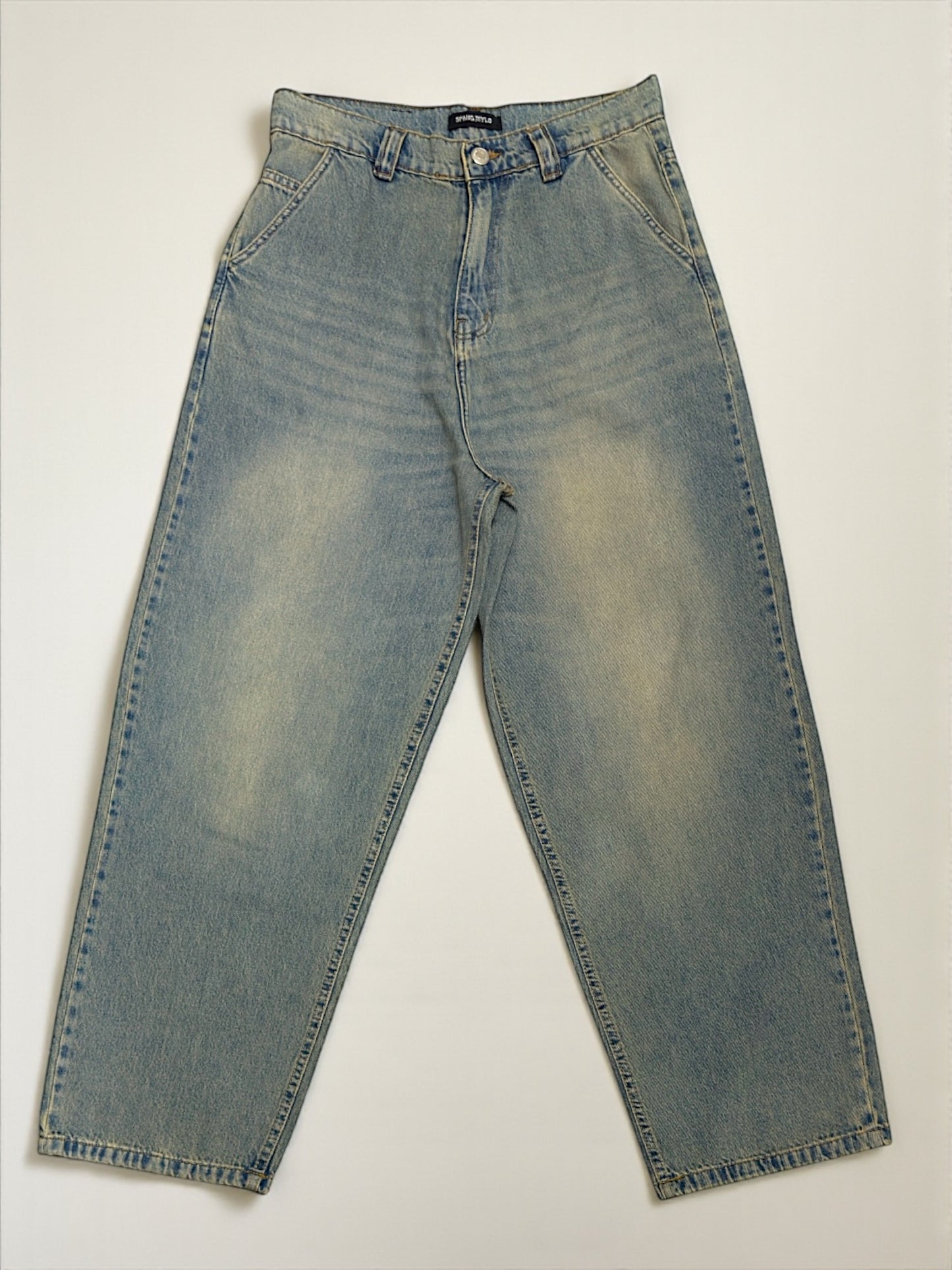 Ballon jeans in mid blue washed with yellow tint