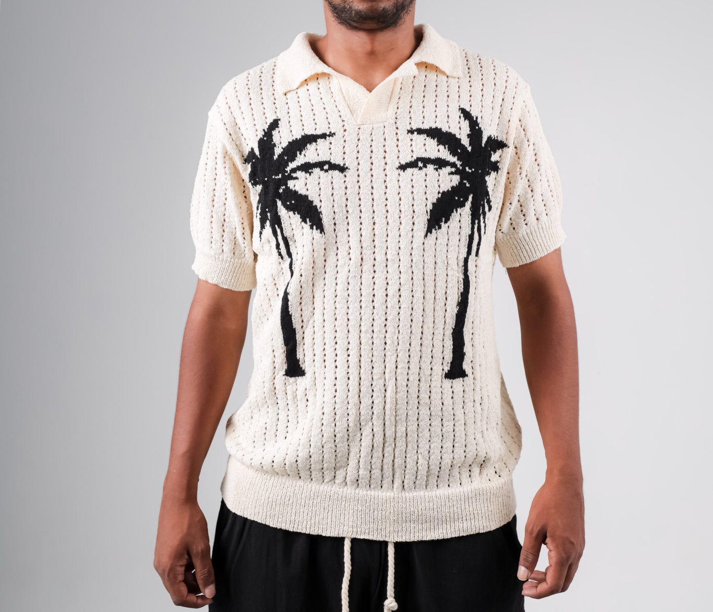 Knitted polo shirt with palm printed