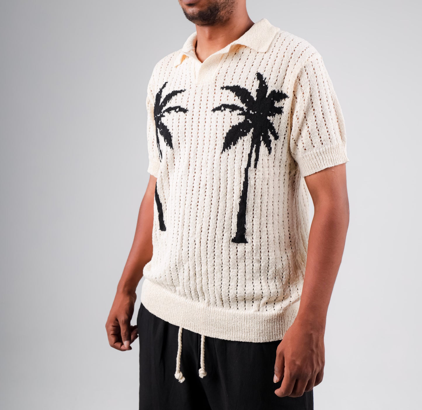 Knitted polo shirt with palm printed