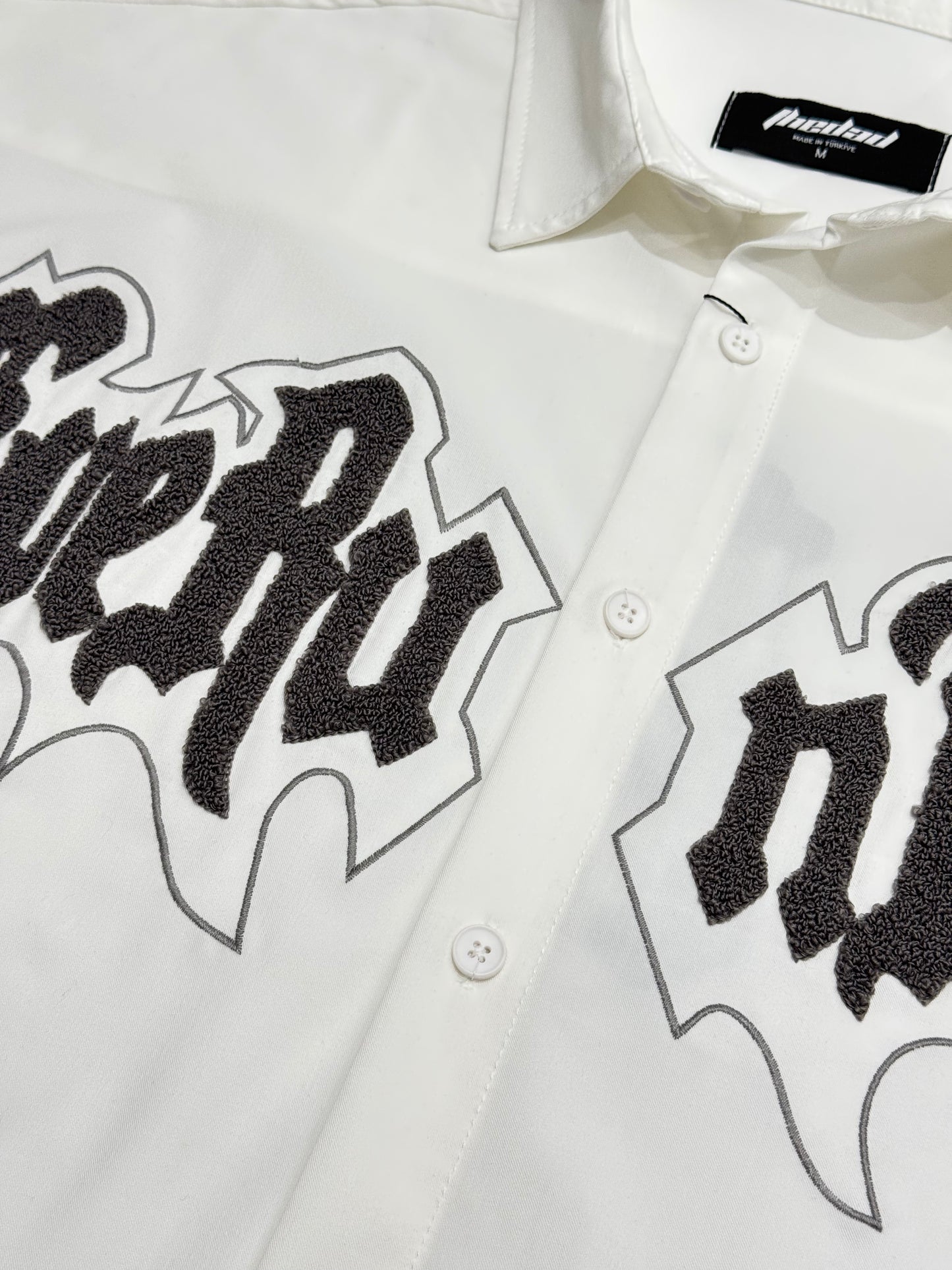 Oversized short sleeve shirt with front teddy stitching