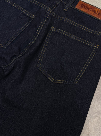 Raw denim pants with yellow stitching