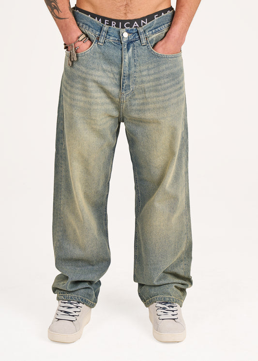 Baggy jeans in dark blue washed with green tint