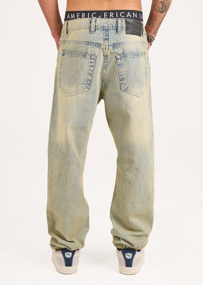 Baggy jeans in light blue with yellow stone wash
