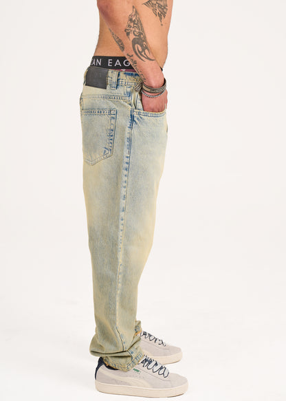 Baggy jeans in light blue with yellow stone wash