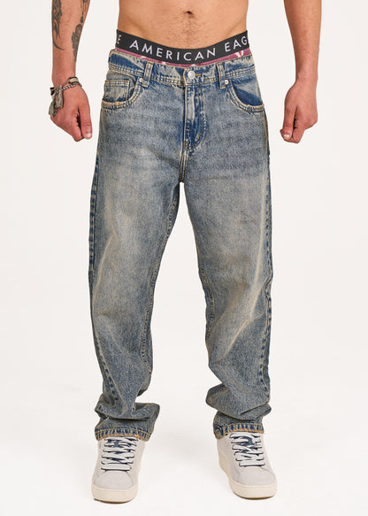 Baggy jeans in dark blue washed with yellow tint