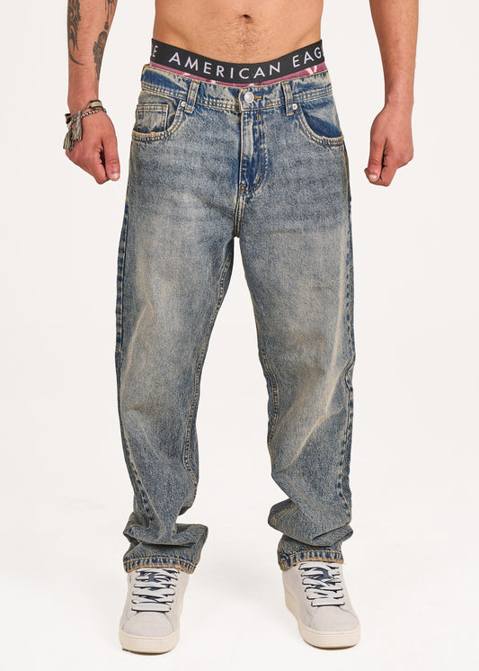 Baggy jeans in dark blue washed with yellow tint
